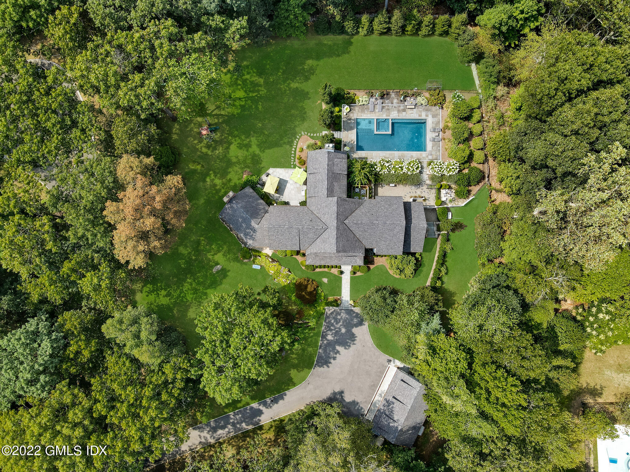 174 Cognewaugh Road Cos Cob, CT 06807 - Photo 34 of 37 an aerial view of a house with a yard