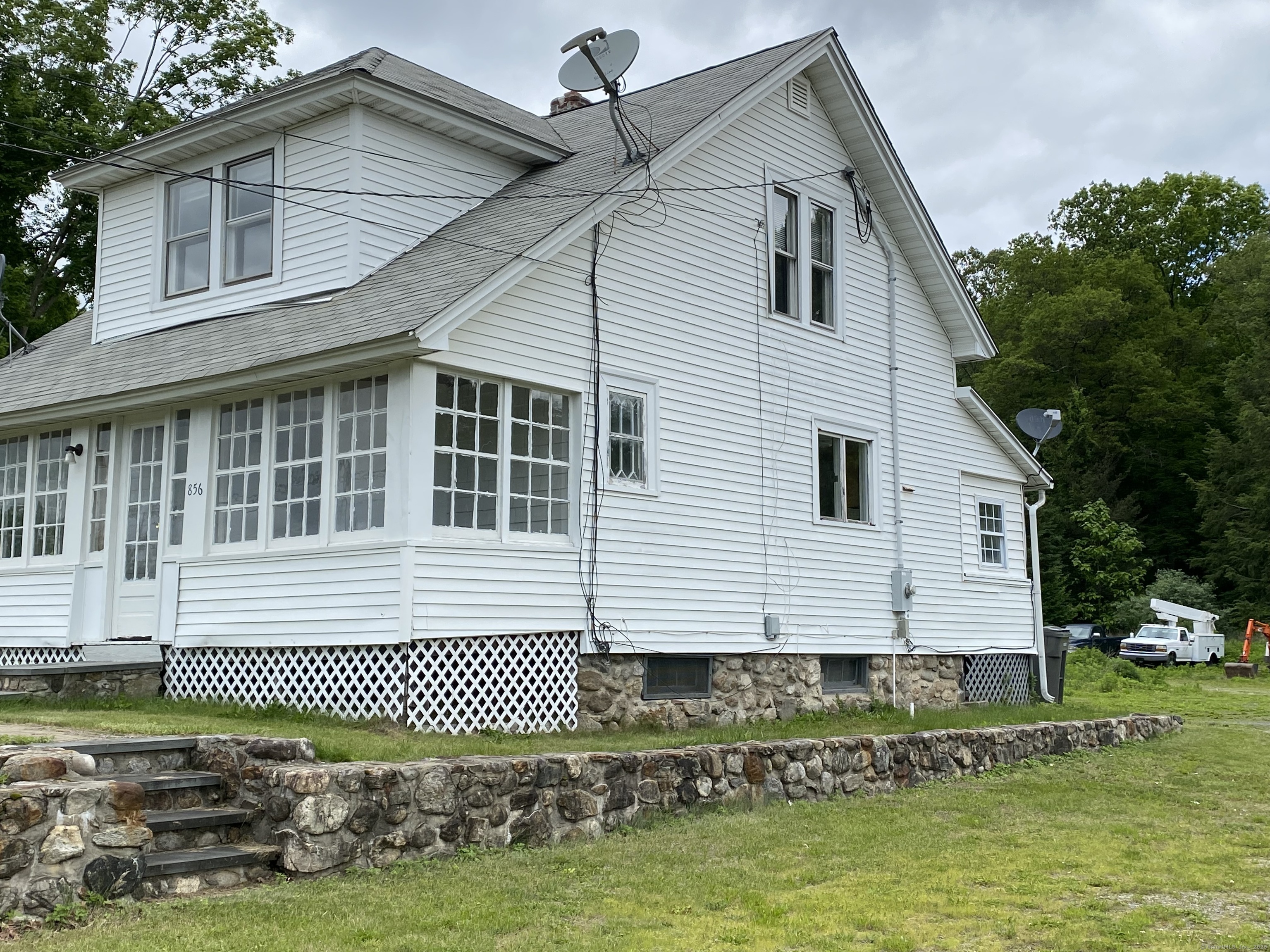 856 New Haven Road Naugatuck, CT 06770 - Photo 2 of 36 a front view of a house with a yard