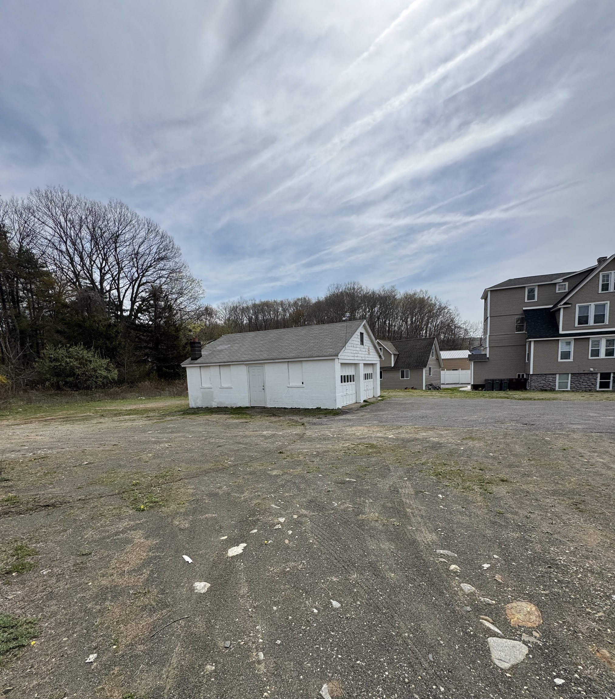 856 New Haven Road Naugatuck, CT 06770 - Photo 24 of 36 a view of a house with a cars park