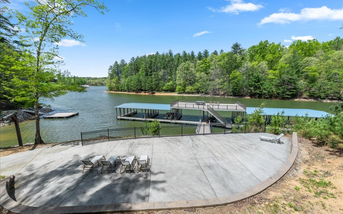 Lt158 Stables Loop Blairsville, GA 30512 - Photo 12 of 42 a view of a swimming pool with an outdoor seating and a garden
