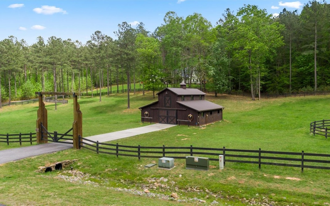 Lt158 Stables Loop Blairsville, GA 30512 - Photo 26 of 42 a view of a table and chairs under an umbrella in a garden