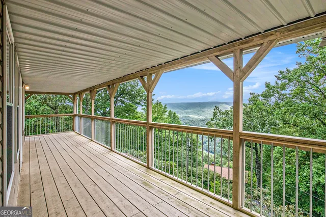 a view of balcony with wooden floor