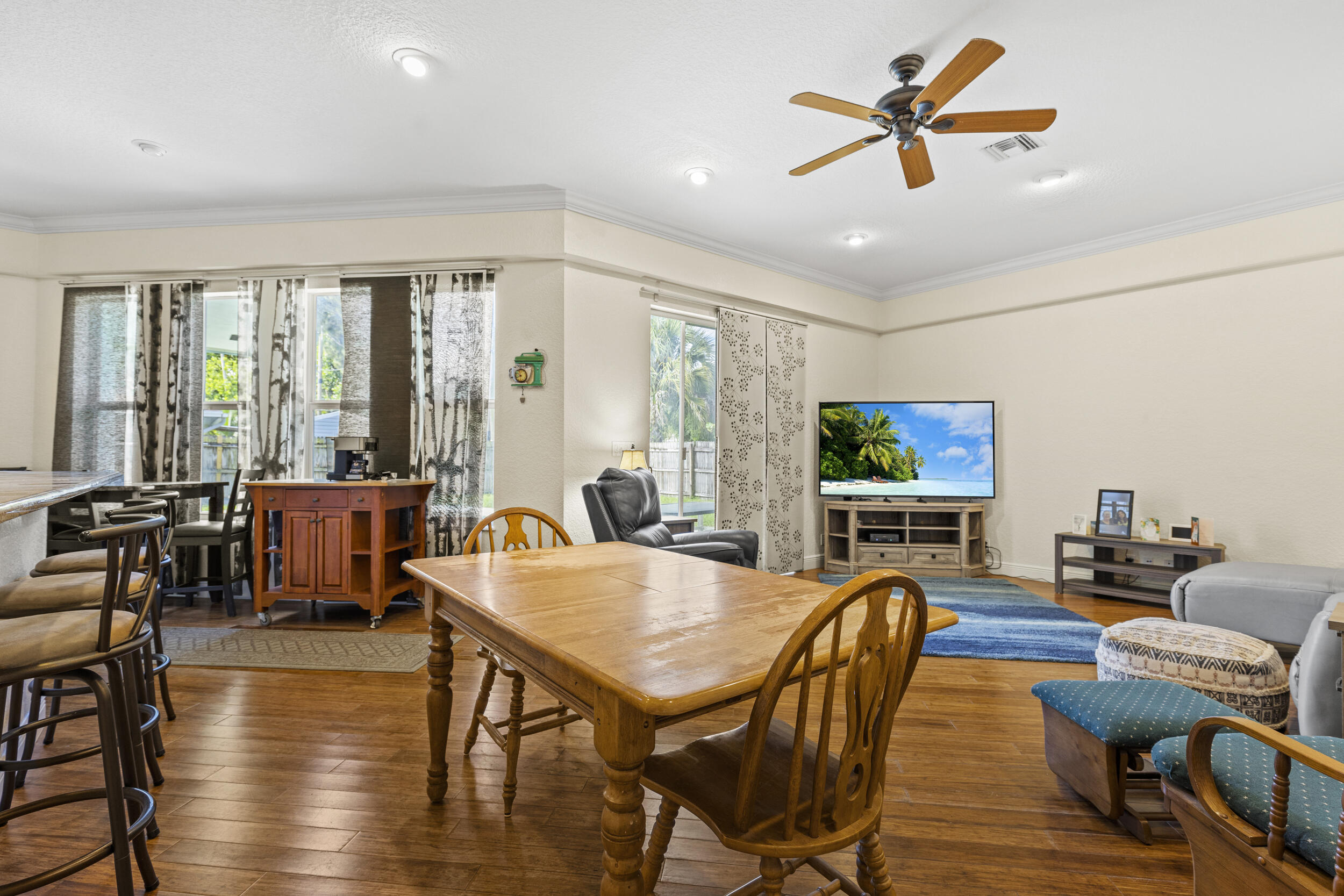 333 Masters Road Palm Springs, FL 33461 - Photo 5 of 15 a view of a dining room with furniture window and wooden floor