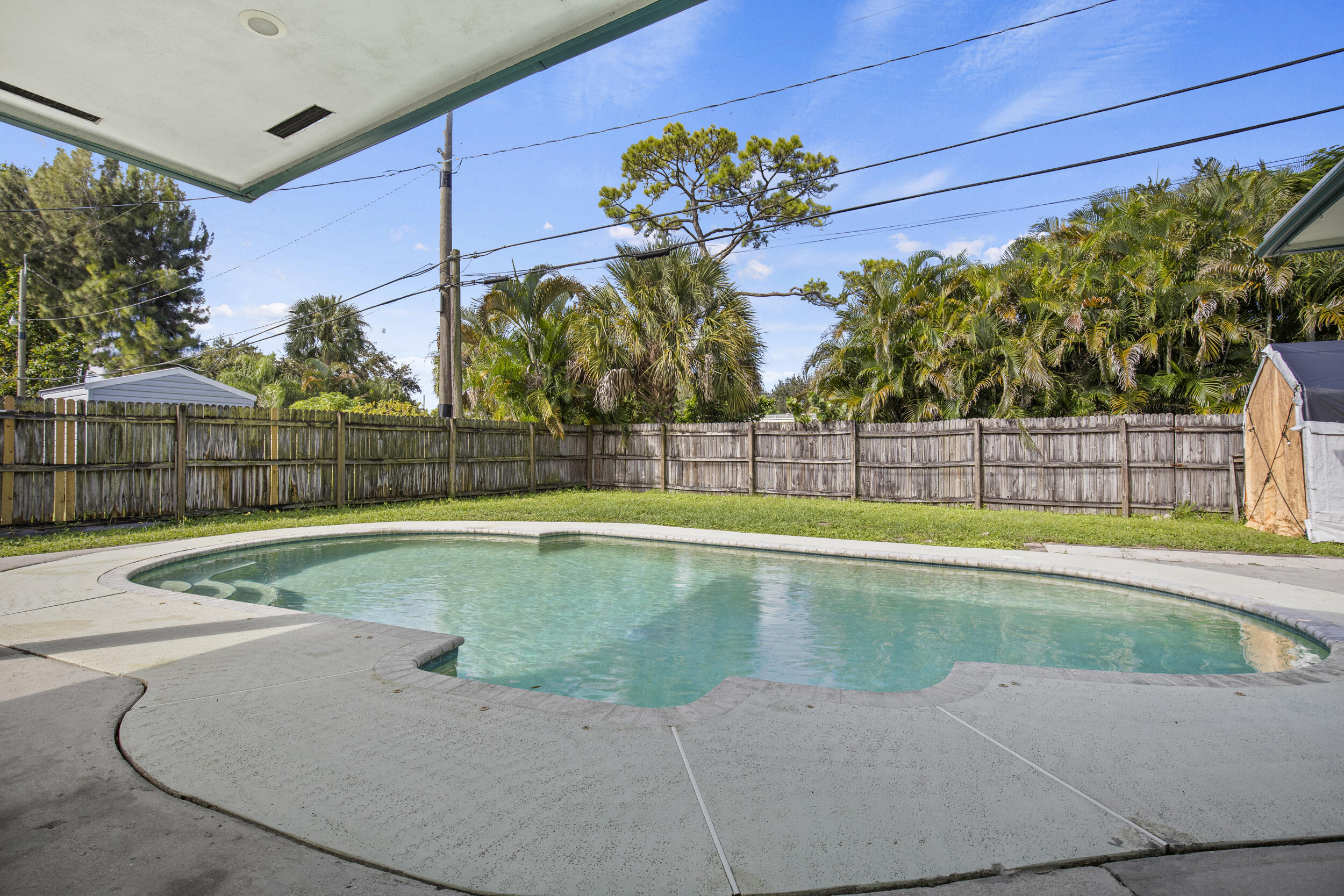 333 Masters Road Palm Springs, FL 33461 - Photo 9 of 15 a view of a backyard