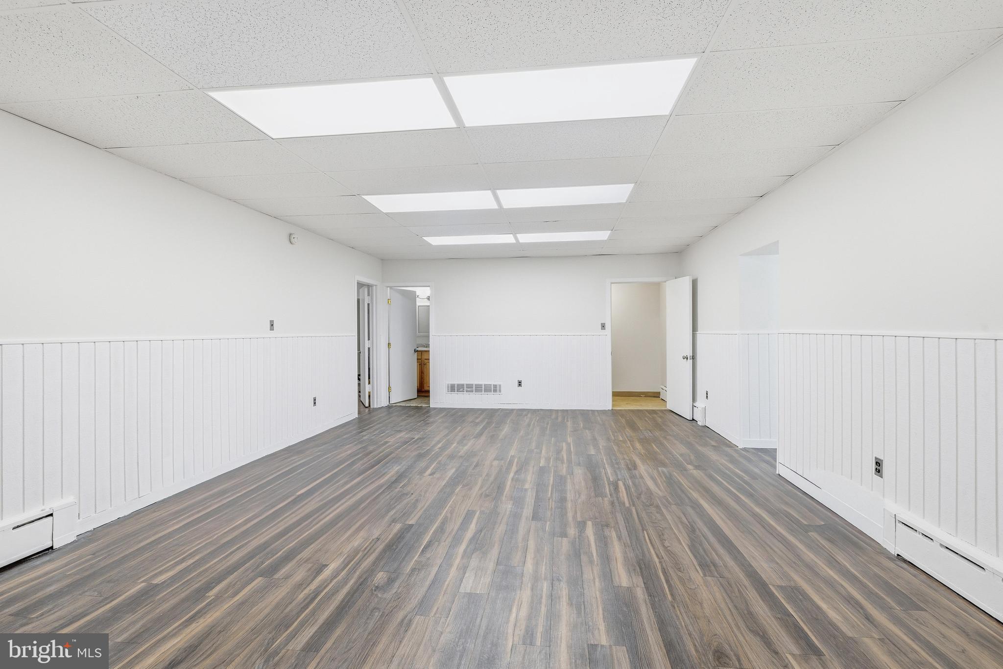 1834 Meetinghouse Road, Unit 1458 Upper Chichester, PA 19061 - Photo 21 of 42 a view of an empty room with wooden floor