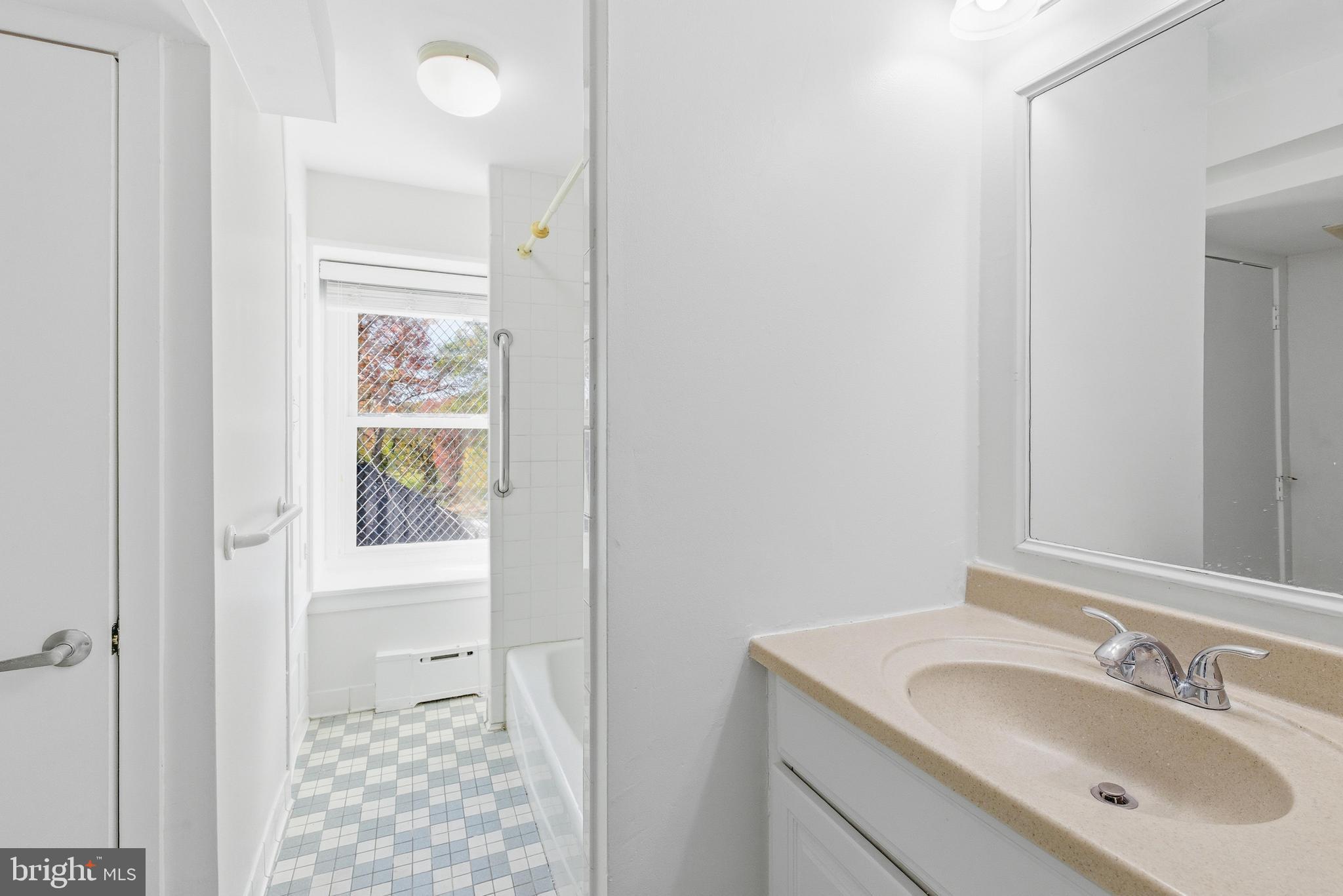 1834 Meetinghouse Road, Unit 1458 Upper Chichester, PA 19061 - Photo 33 of 42 a bathroom with a sink and a mirror