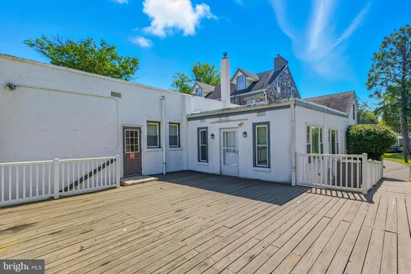 a view of a house with wooden deck