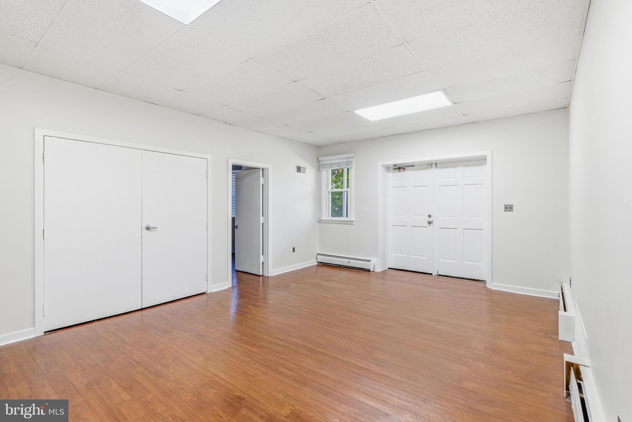 1834 Meetinghouse Road, Unit 1458 Upper Chichester, PA 19061 - Photo 10 of 42 wooden floor in an empty room