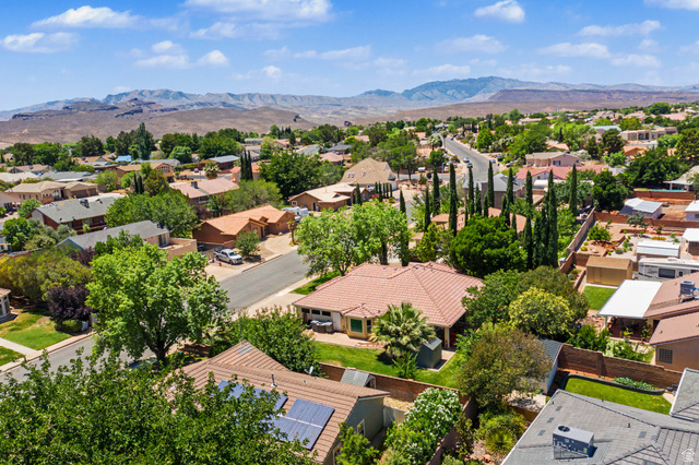 3034 Swiss Drive Santa Clara, UT 84765 - Photo 49 of 59 Residential neighborhood featuring mature landscaping, paved roadways, and a backdrop of distant mountains