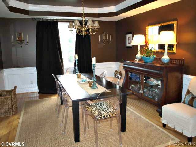 1326 Gravity Hill Road Midlothian, VA 23114 - Photo 3 of 12 a view of a dining room with furniture and chandelier