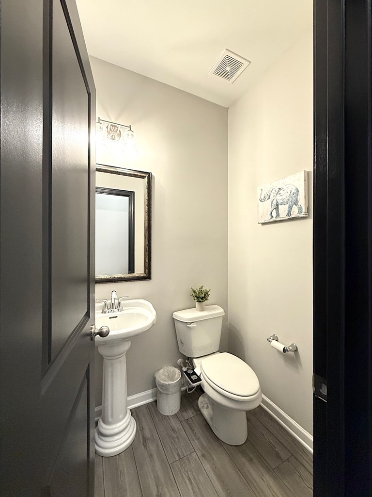 27 Sugar Maple Drive Fort Mitchell, AL 36856 - Photo 13 of 28 a white toilet sitting next to a bathroom sink