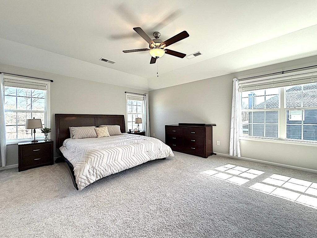 27 Sugar Maple Drive Fort Mitchell, AL 36856 - Photo 14 of 28 a spacious bedroom with a bed and a window