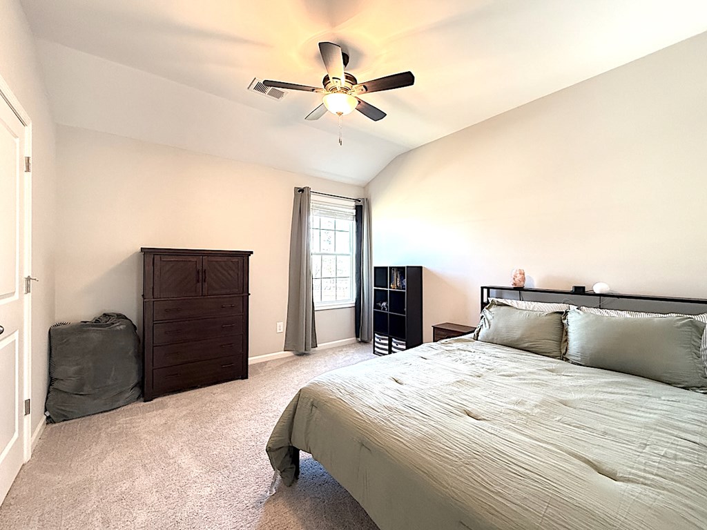 27 Sugar Maple Drive Fort Mitchell, AL 36856 - Photo 21 of 28 a bed room with a bed and dresser
