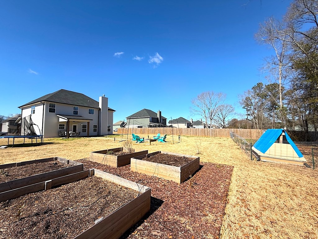 27 Sugar Maple Drive Fort Mitchell, AL 36856 - Photo 25 of 28 a view of a swimming pool with a lounge chairs