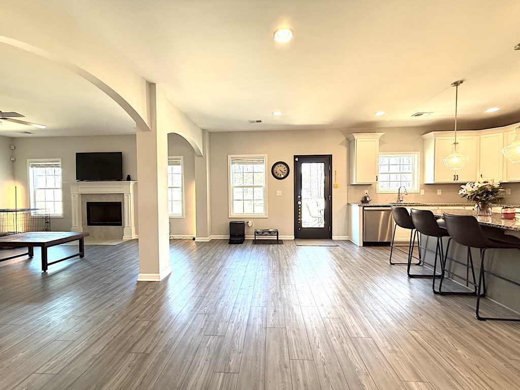 27 Sugar Maple Drive Fort Mitchell, AL 36856 - Photo 9 of 28 a view of a living room and dining room with furniture wooden floor and windows