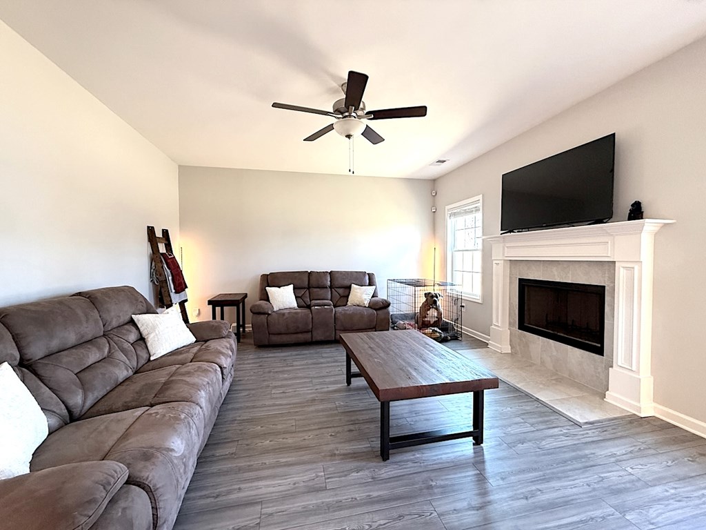 27 Sugar Maple Drive Fort Mitchell, AL 36856 - Photo 10 of 28 a living room with furniture fireplace and a flat screen tv