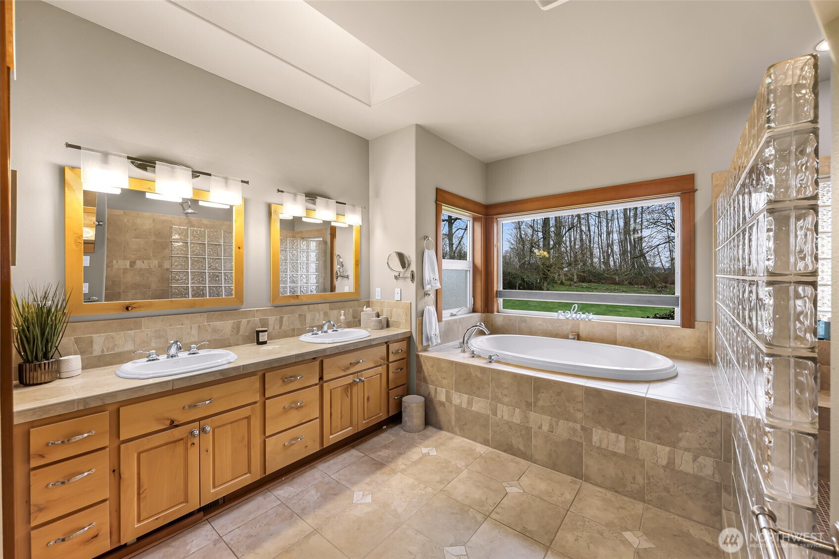 7067 Yukon Way Ferndale, WA 98248 - Photo 19 of 40 a bathroom with a tub sink and mirror