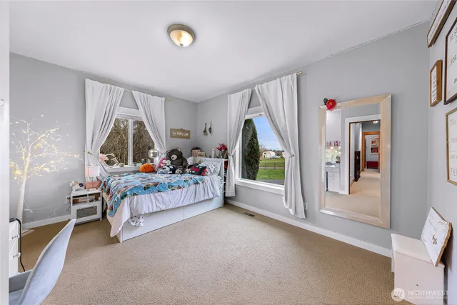 a bedroom with furniture and a window