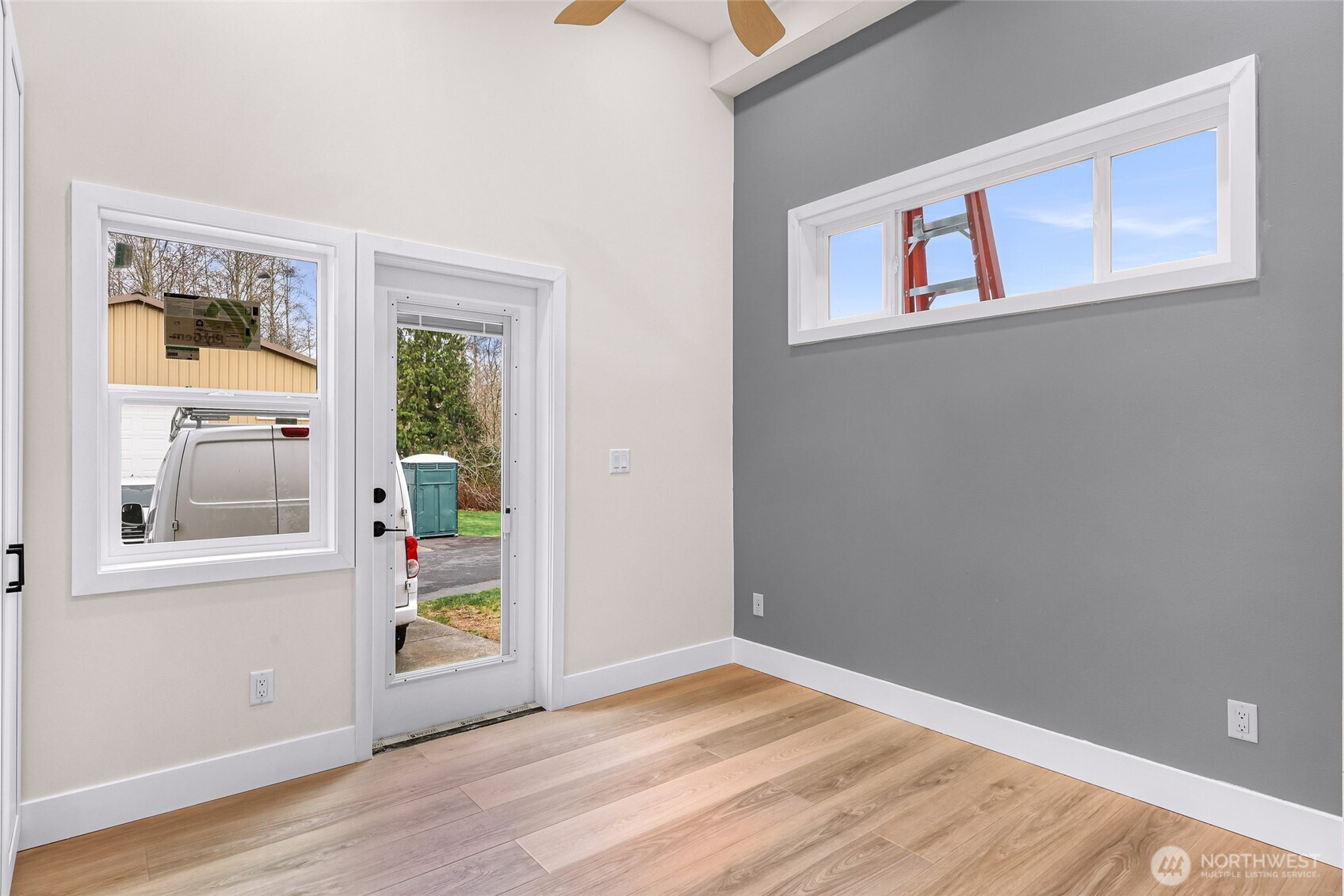 7067 Yukon Way Ferndale, WA 98248 - Photo 34 of 40 a view of an empty room with a window and wooden floor