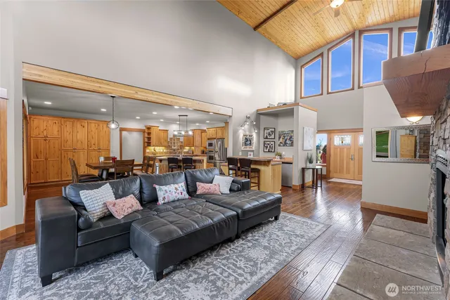 a living room with furniture fireplace and a table