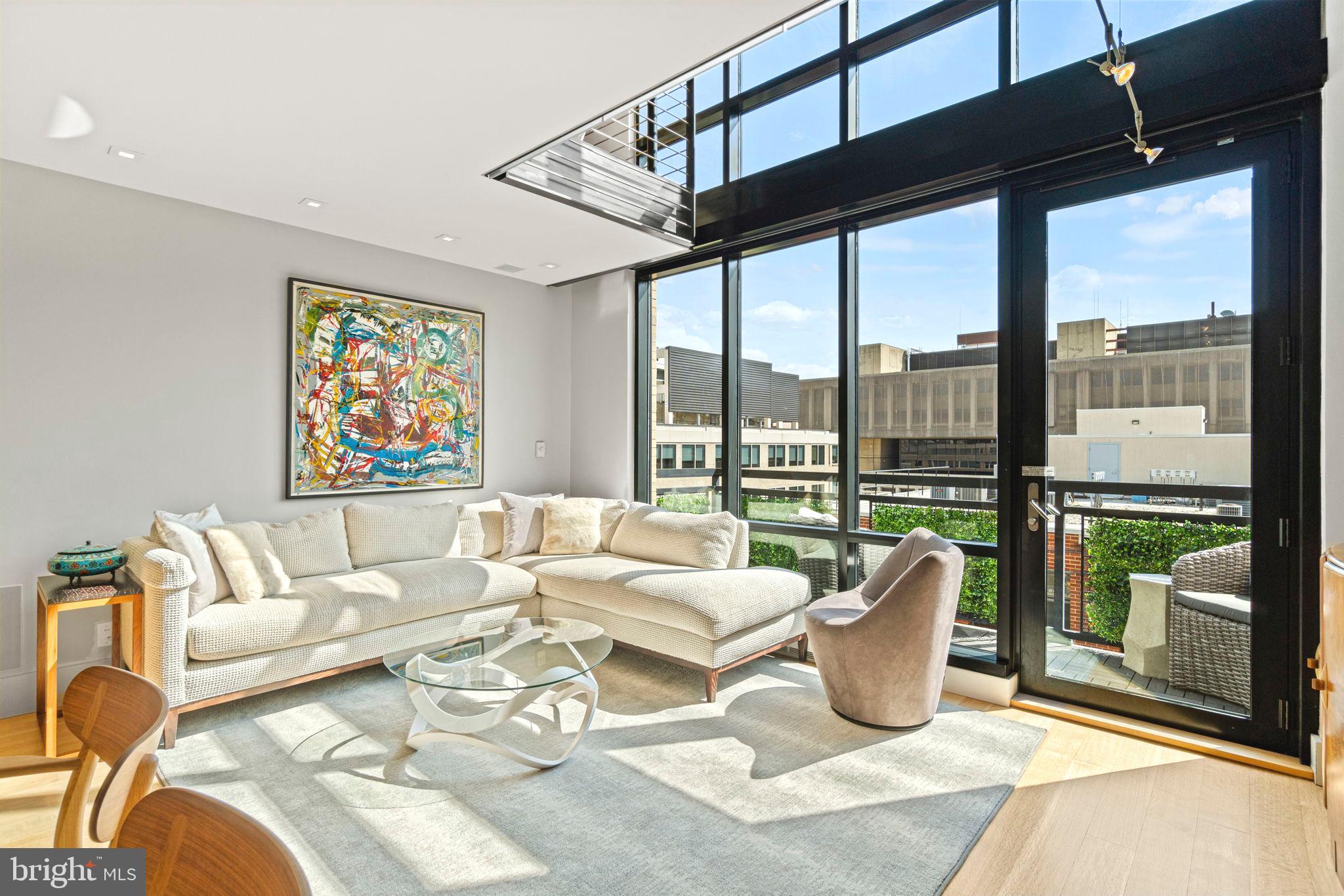 912 F Street Northwest, Unit 1100 Washington, DC 20004 - Photo 1 of 23 a living room with furniture and a floor to ceiling window