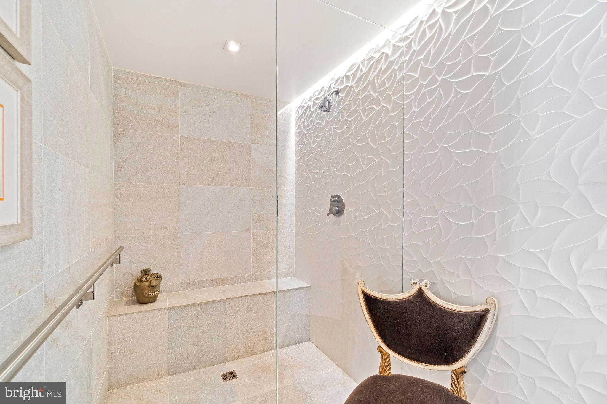 912 F Street Northwest, Unit 1100 Washington, DC 20004 - Photo 11 of 23 a bathroom with a bathtub and shower