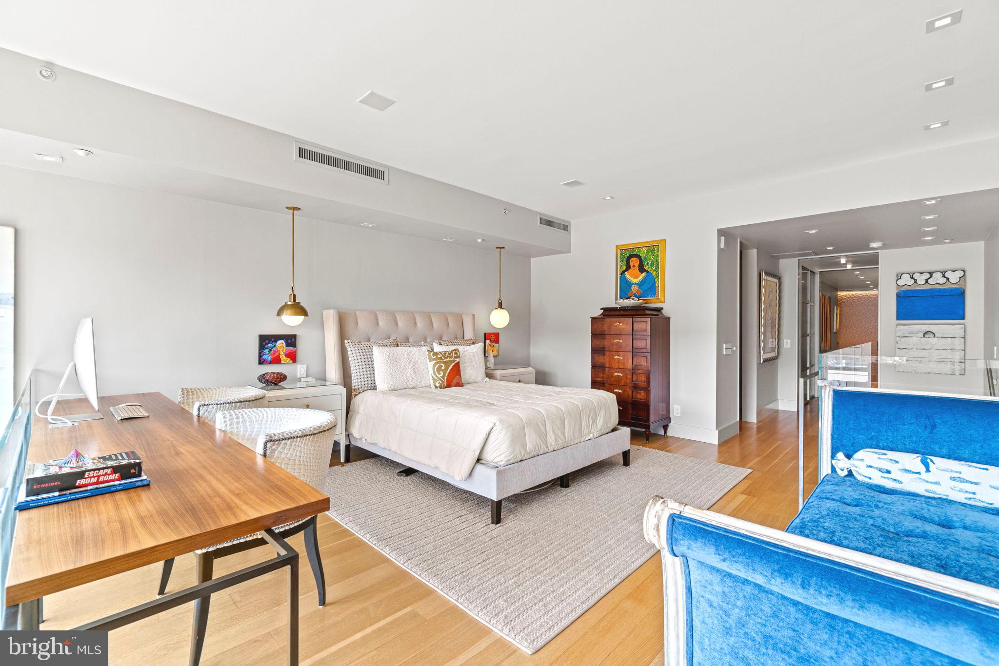 912 F Street Northwest, Unit 1100 Washington, DC 20004 - Photo 15 of 23 a bedroom with a bed and wooden floor