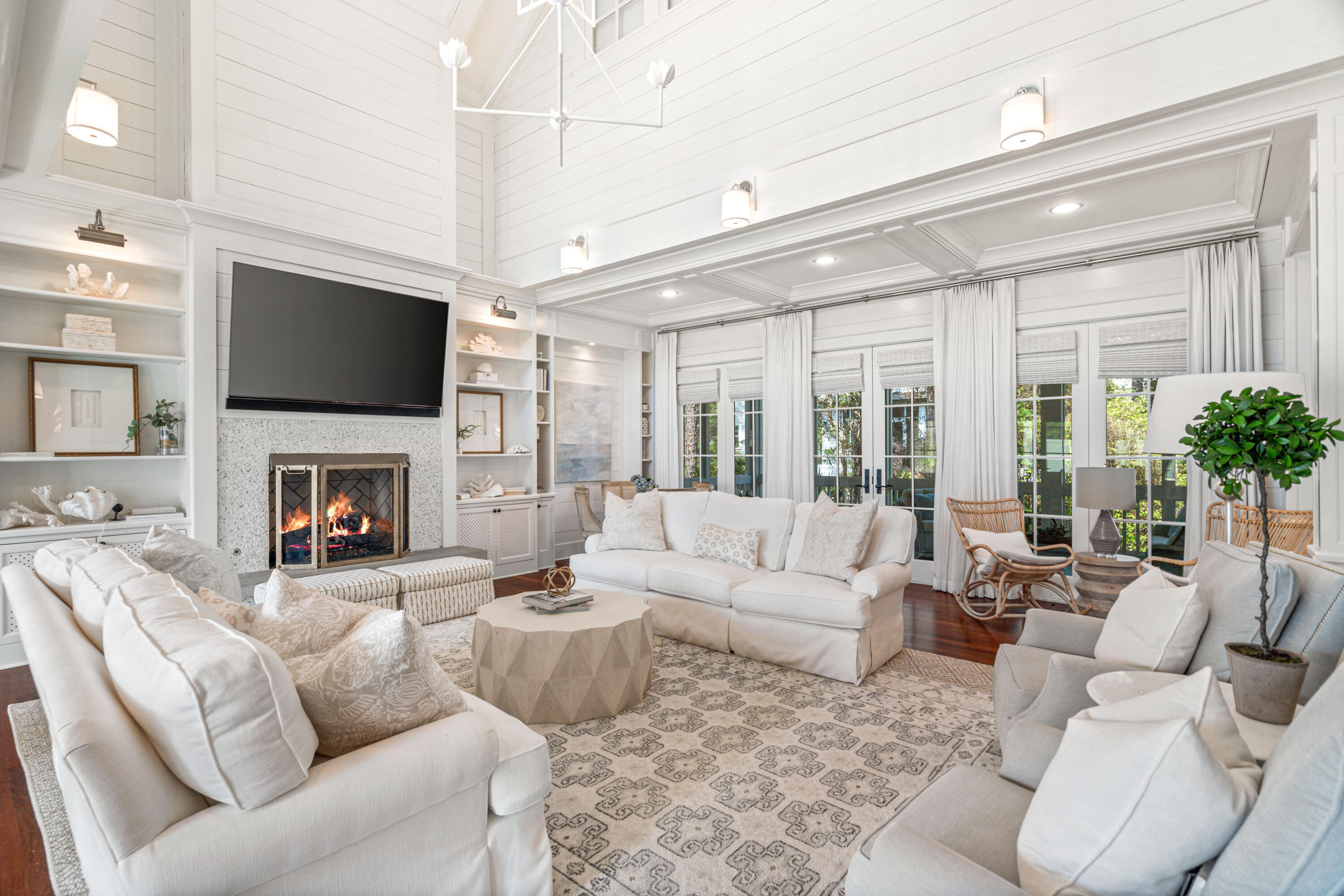 8 Shingle Lane Watersound, FL 32461 - Photo 11 of 73 a living room with furniture a flat screen tv and a fireplace