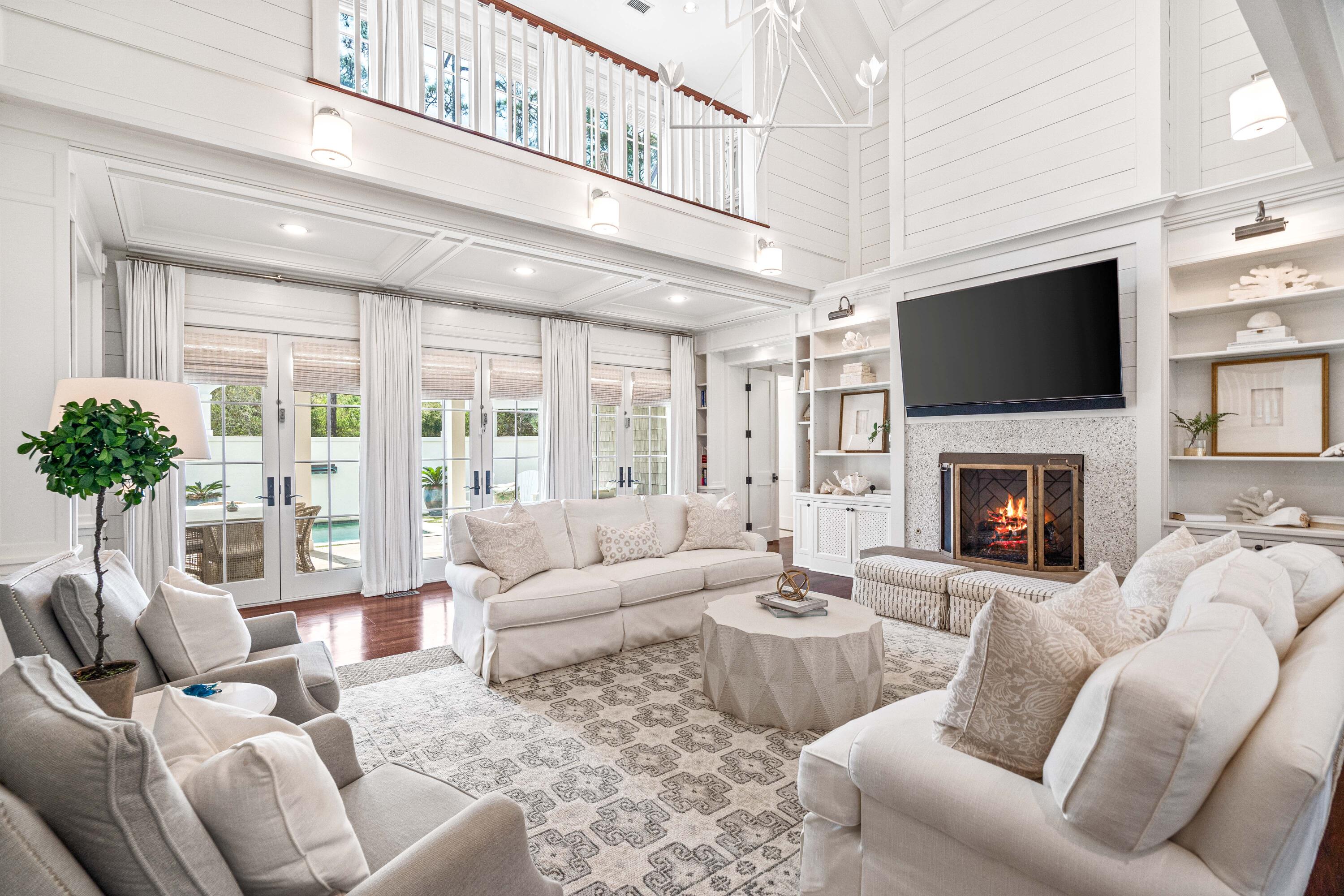 8 Shingle Lane Watersound, FL 32461 - Photo 15 of 73 a living room with furniture a flat screen tv and a fireplace