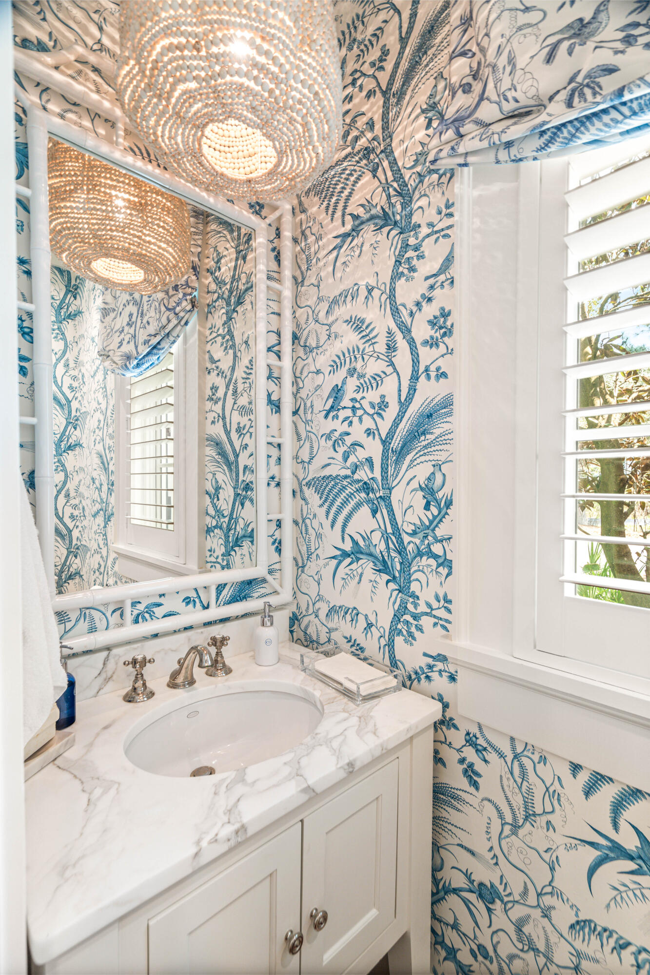 8 Shingle Lane Watersound, FL 32461 - Photo 24 of 73 a bathroom with a granite countertop sink and a mirror