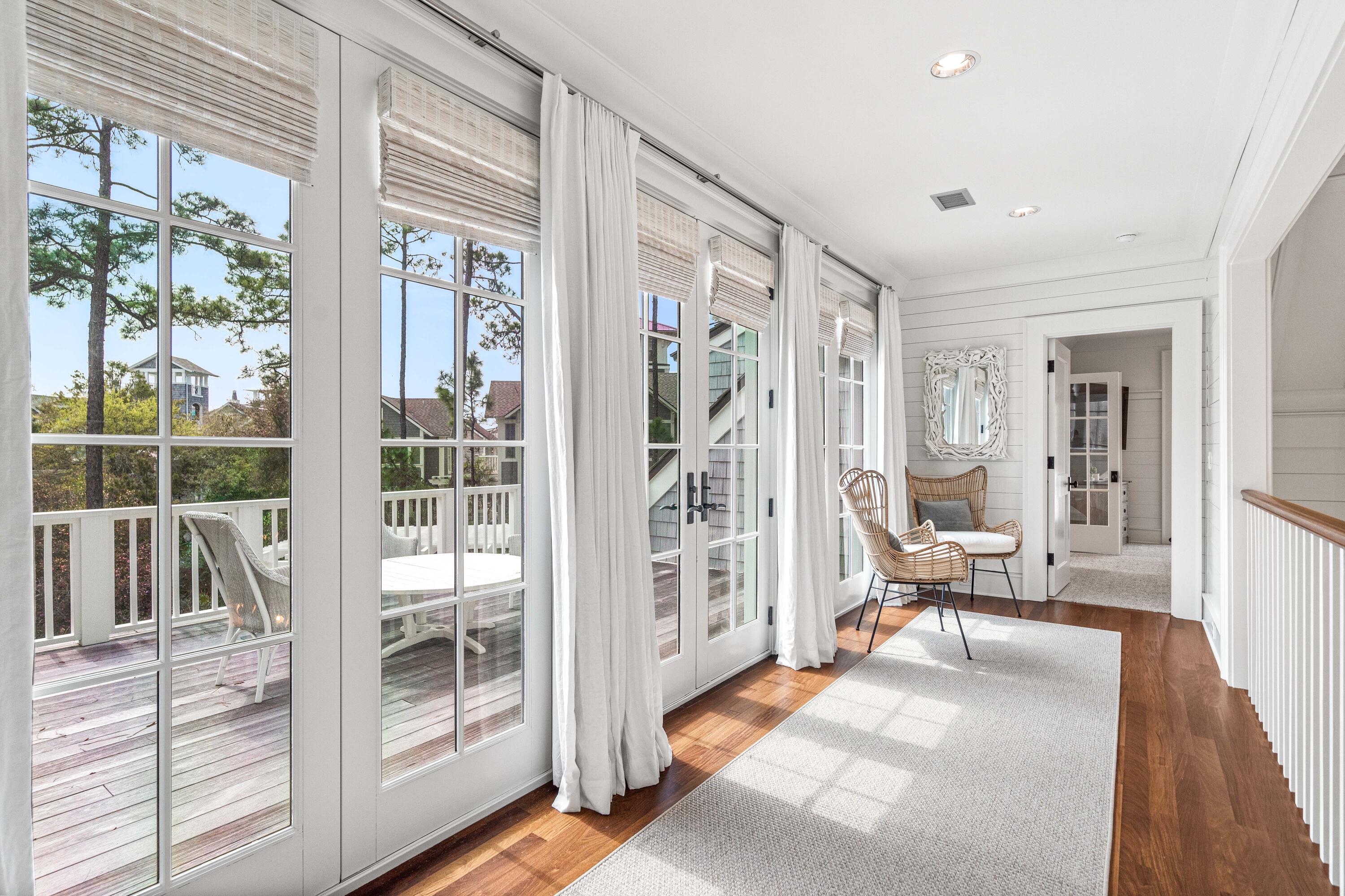 8 Shingle Lane Watersound, FL 32461 - Photo 30 of 73 a living room with furniture and a large window