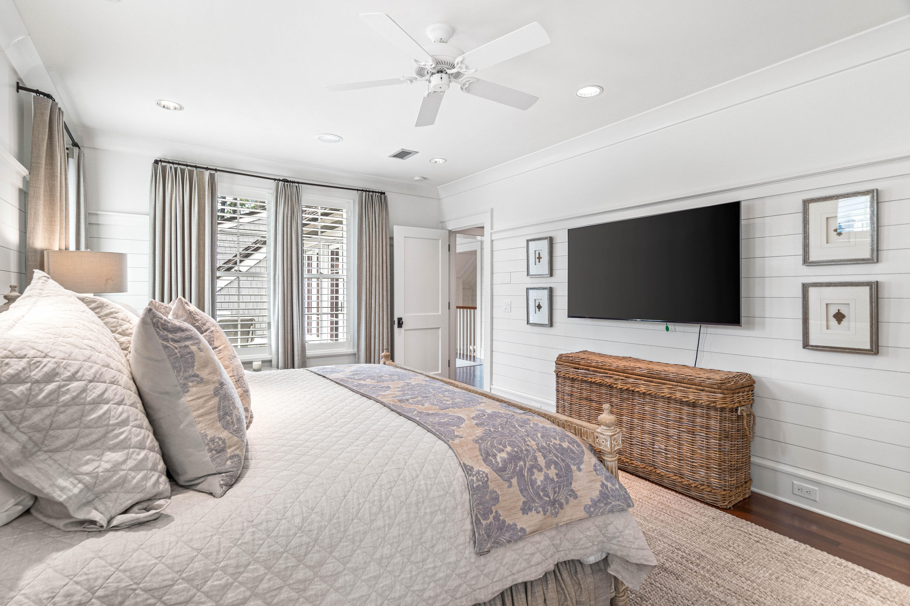 8 Shingle Lane Watersound, FL 32461 - Photo 32 of 73 a bedroom with a bed and a flat screen tv