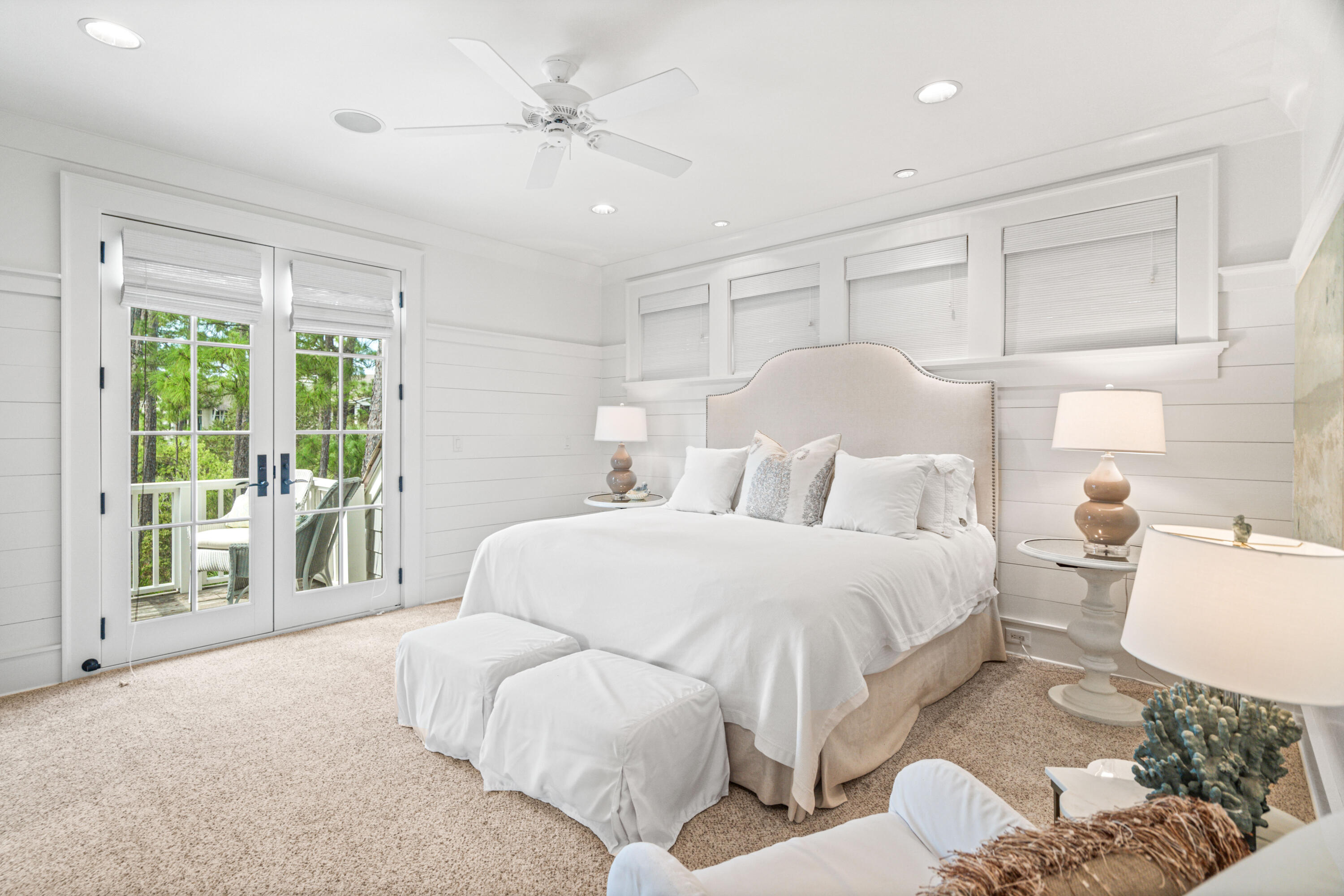 8 Shingle Lane Watersound, FL 32461 - Photo 35 of 73 a bedroom with a large bed and a chandelier fan