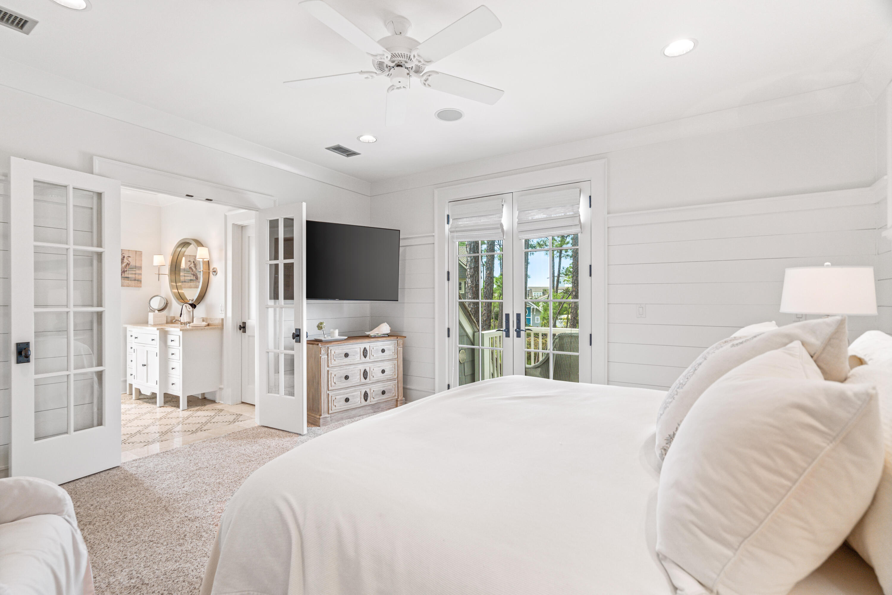 8 Shingle Lane Watersound, FL 32461 - Photo 36 of 73 a bedroom with a large bed and a flat screen tv