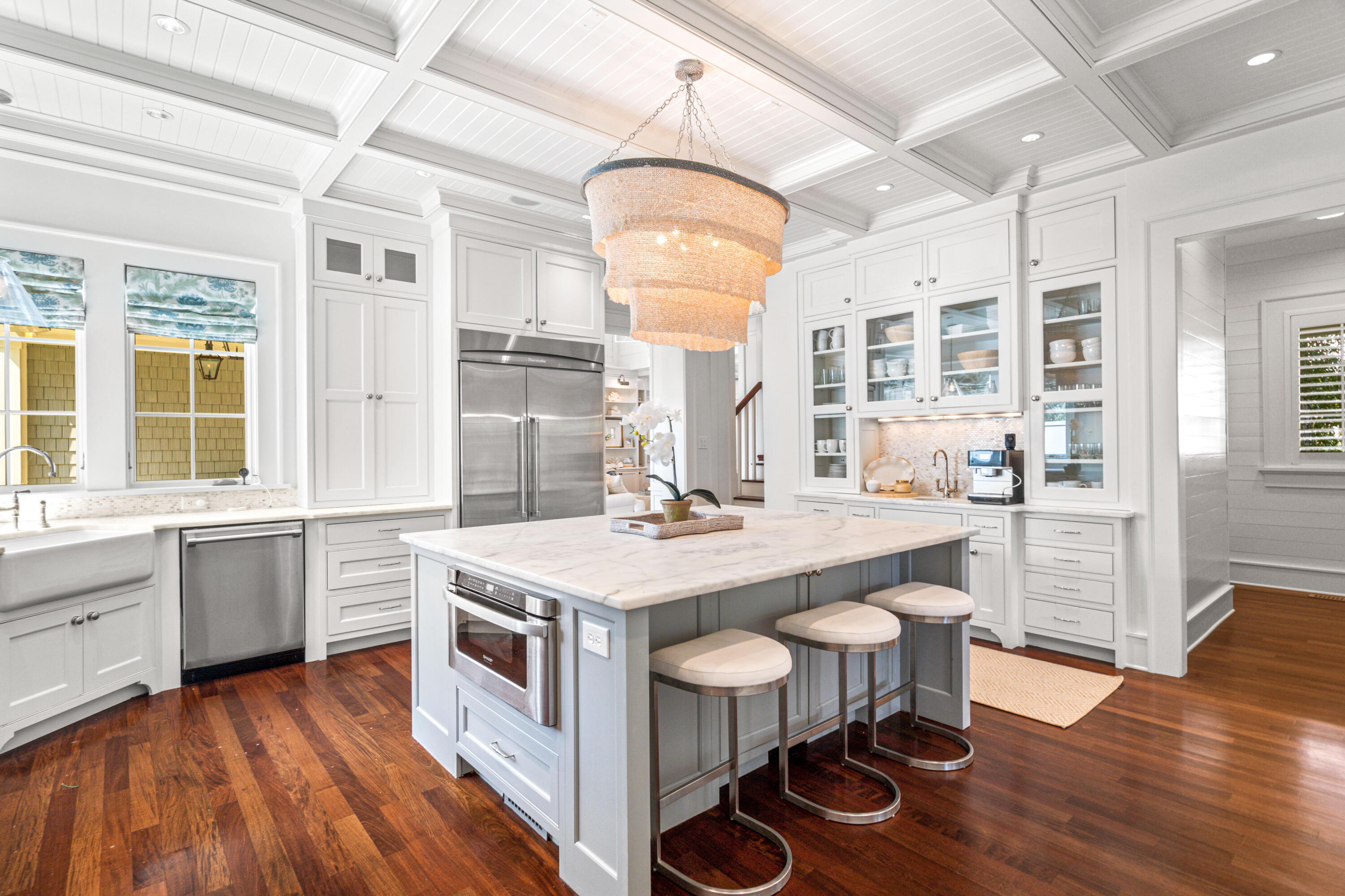 8 Shingle Lane Watersound, FL 32461 - Photo 5 of 73 a kitchen with center island and wooden floor