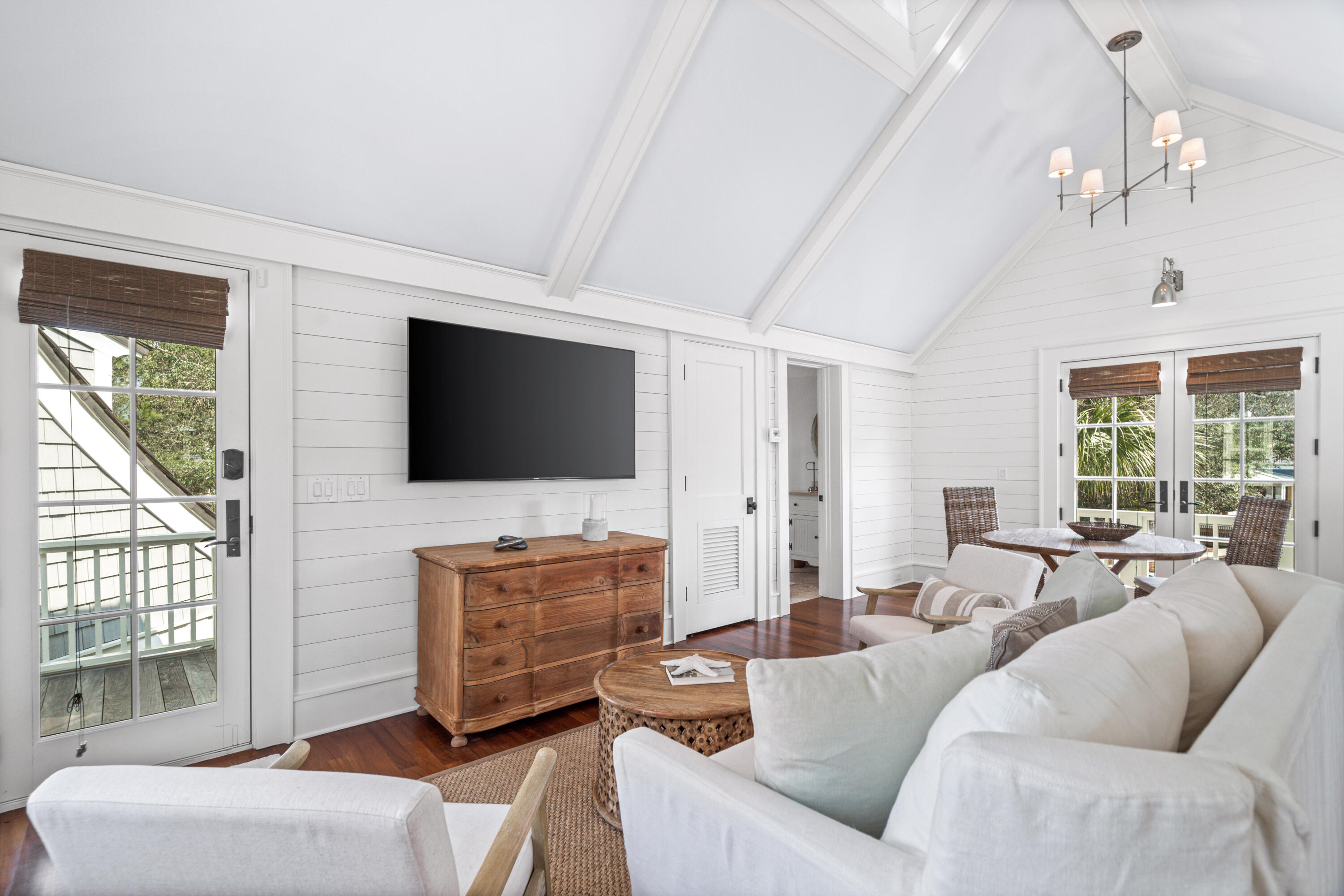 8 Shingle Lane Watersound, FL 32461 - Photo 55 of 73 a living room with furniture a flat screen tv and a large window