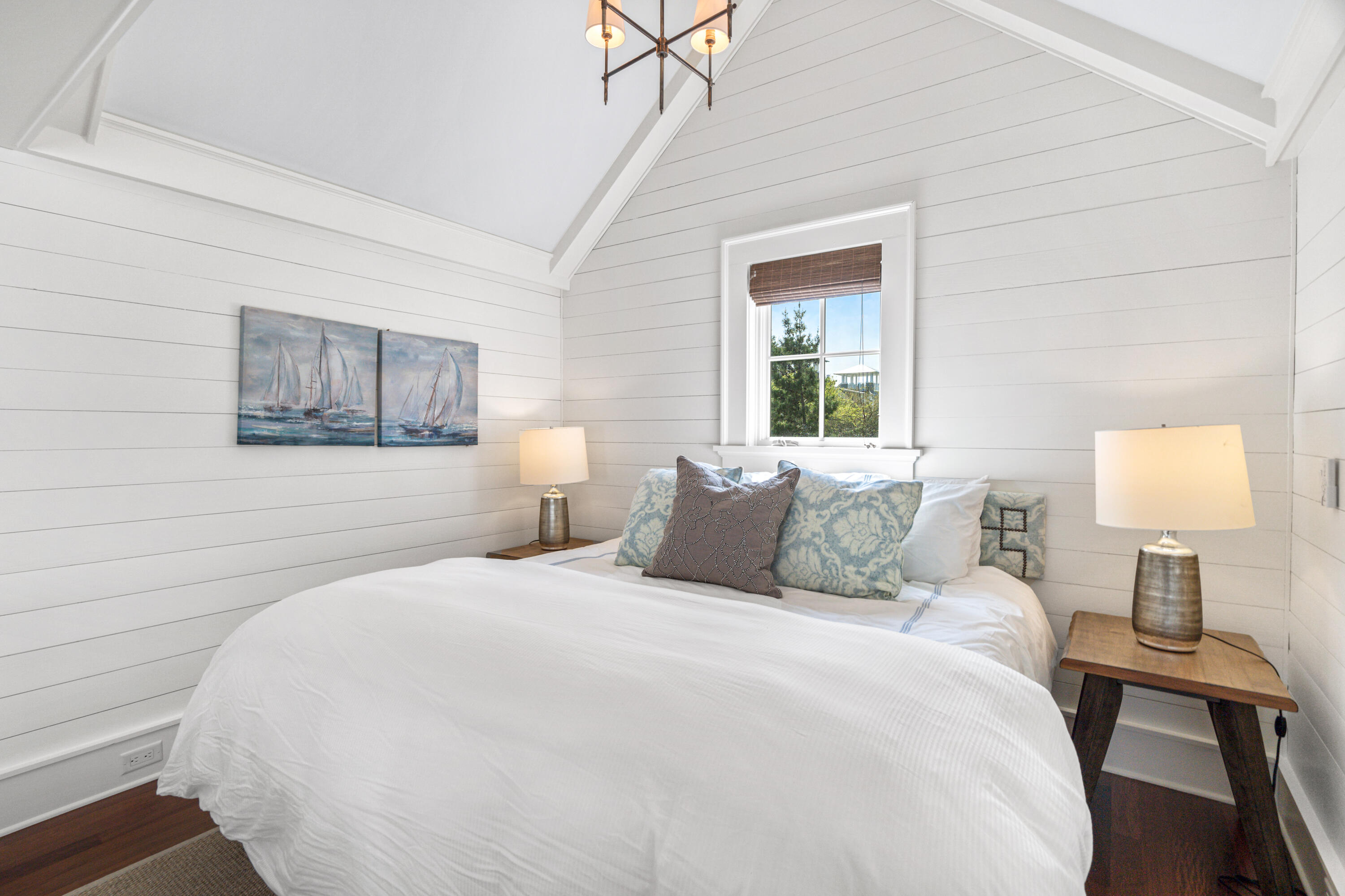 8 Shingle Lane Watersound, FL 32461 - Photo 56 of 73 a bedroom with a bed and a lamp