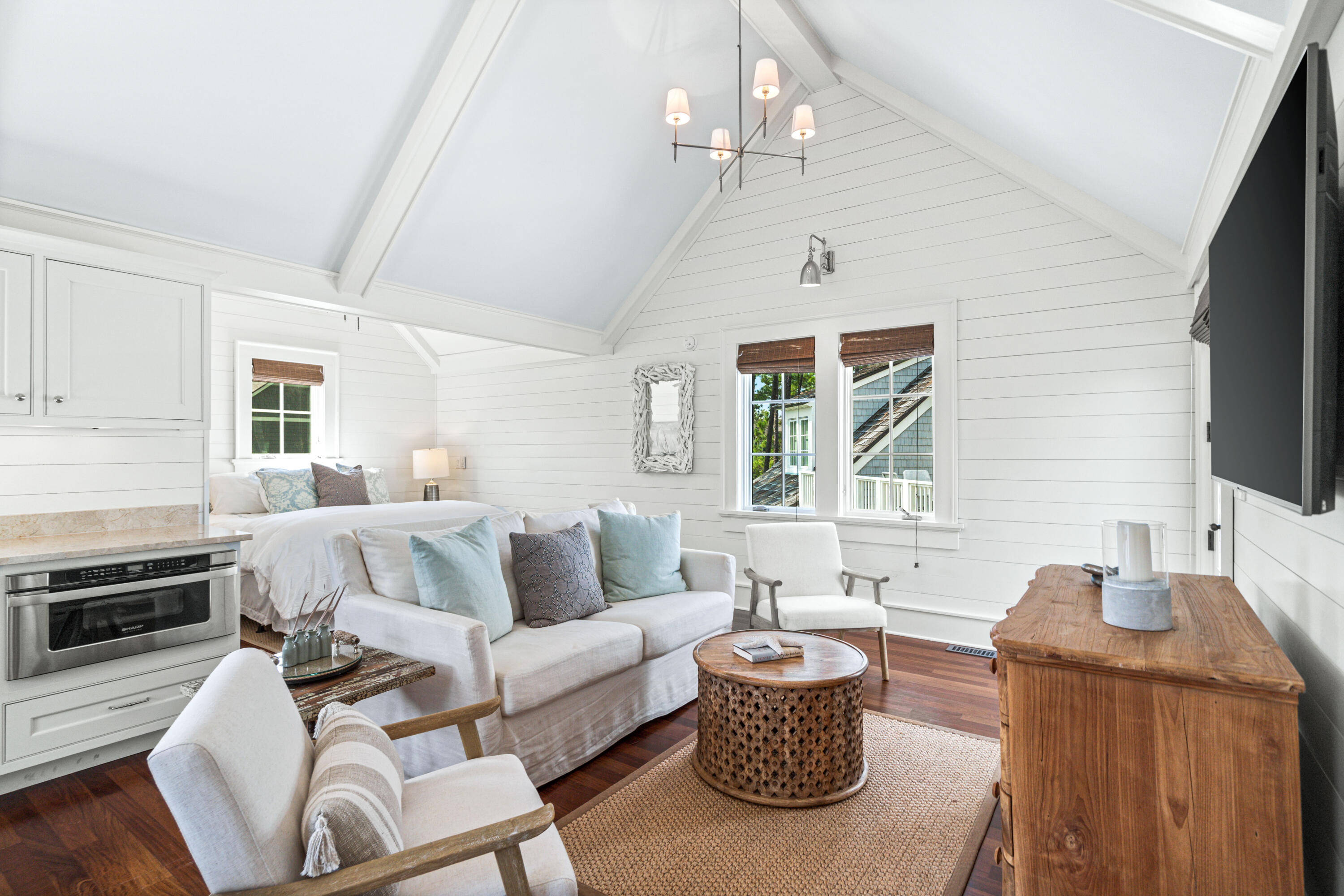 8 Shingle Lane Watersound, FL 32461 - Photo 58 of 73 a living room with furniture a chandelier and a flat screen tv