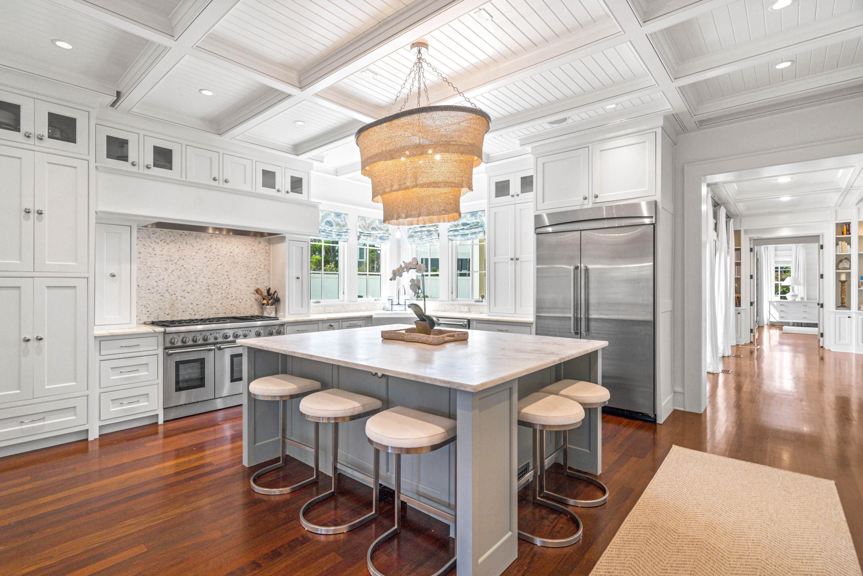 8 Shingle Lane Watersound, FL 32461 - Photo 6 of 73 a kitchen with stainless steel appliances granite countertop a sink stove and wooden floor