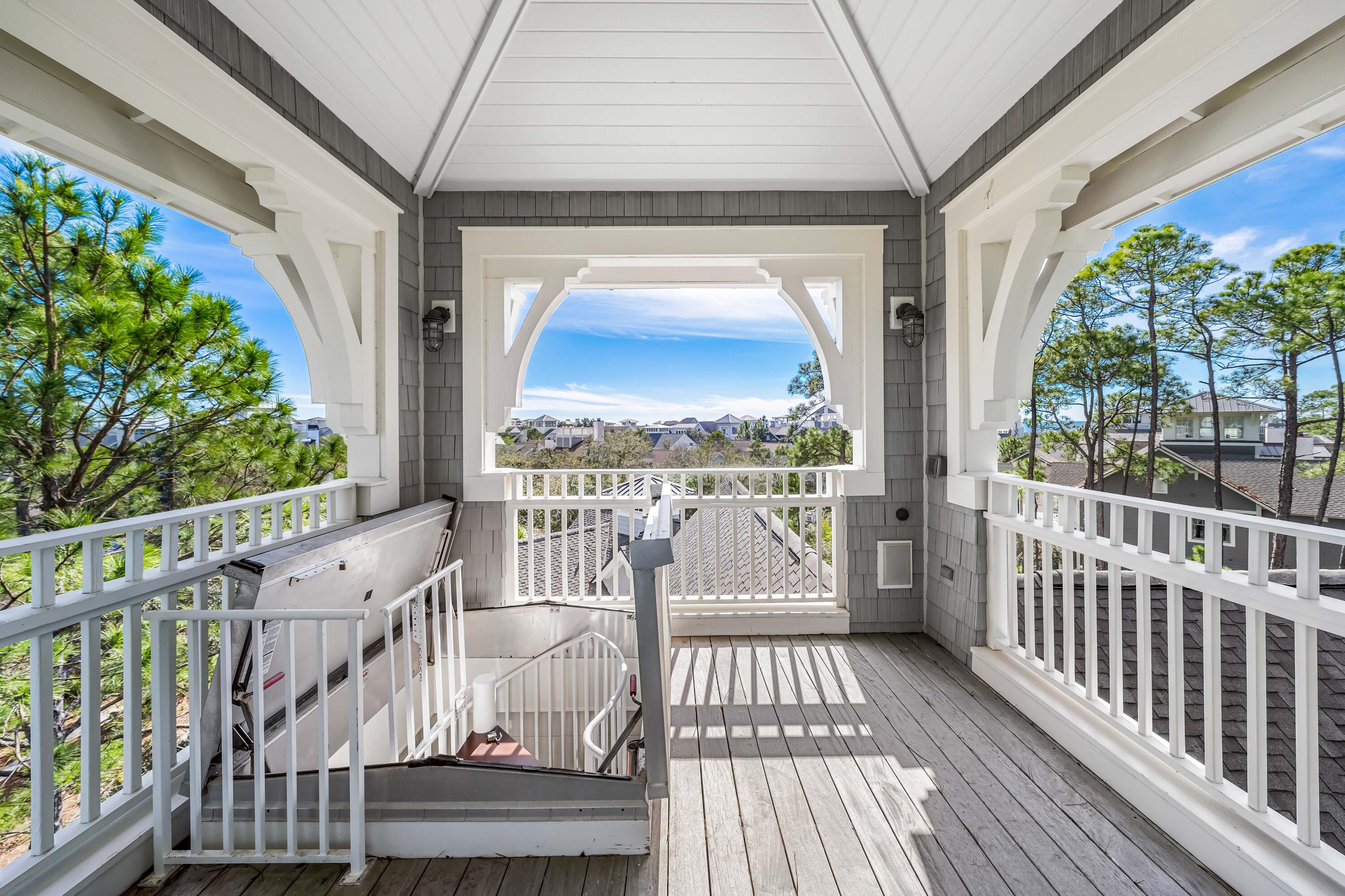 8 Shingle Lane Watersound, FL 32461 - Photo 66 of 73 a view of a balcony with wooden floor