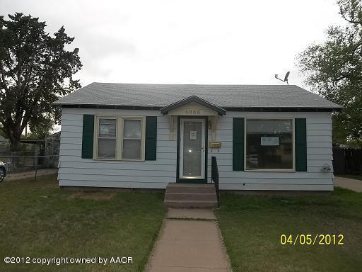 4008 South Hughes Street Amarillo, TX 79110 - Photo 1 of 7 a front view of a house with a garden