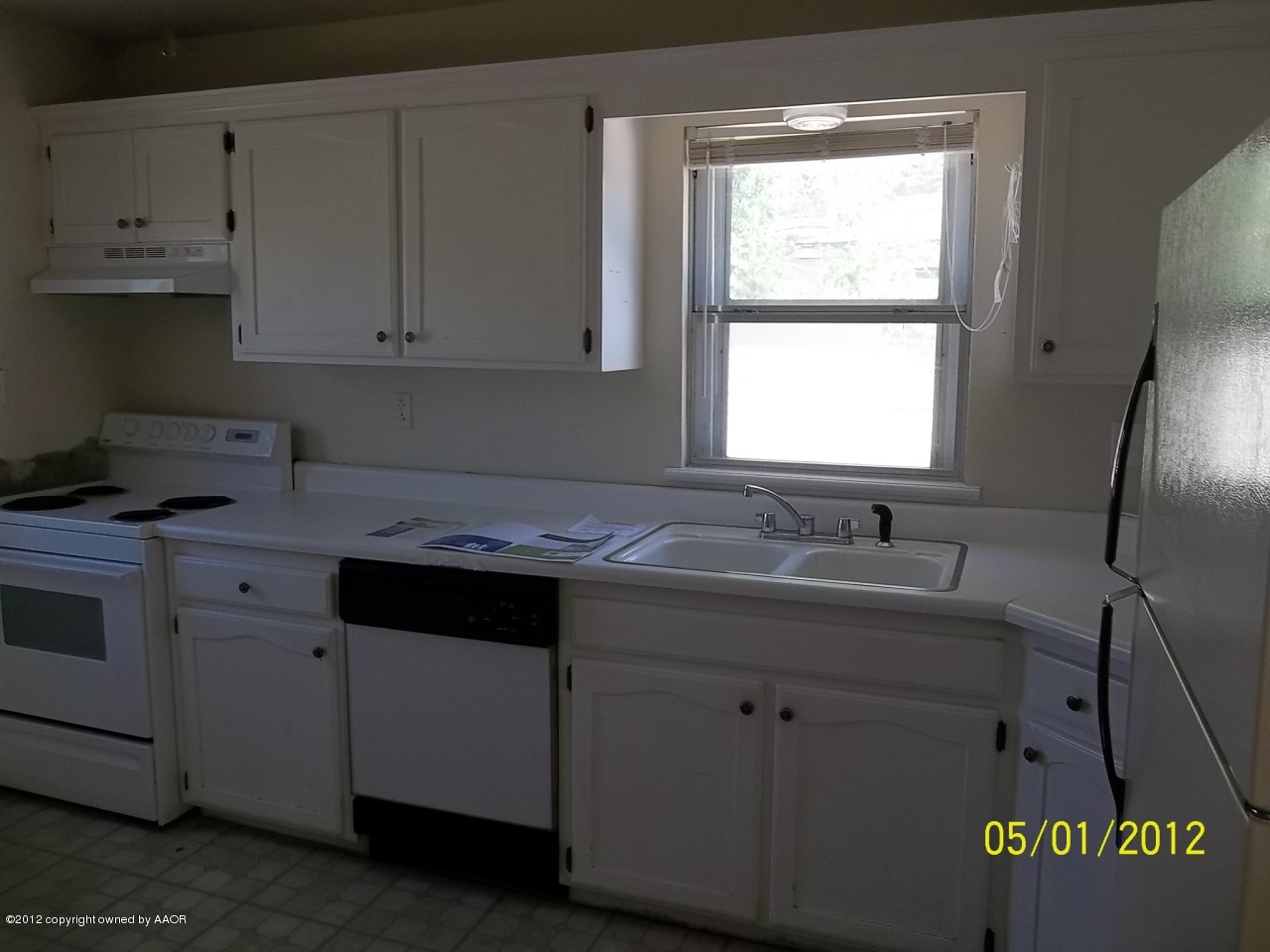 4008 South Hughes Street Amarillo, TX 79110 - Photo 2 of 7 a kitchen with stainless steel appliances granite countertop a sink stove and cabinets