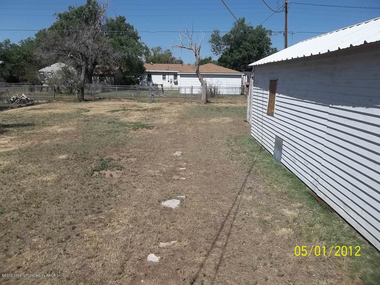 4008 South Hughes Street Amarillo, TX 79110 - Photo 6 of 7 a view of a house with a backyard
