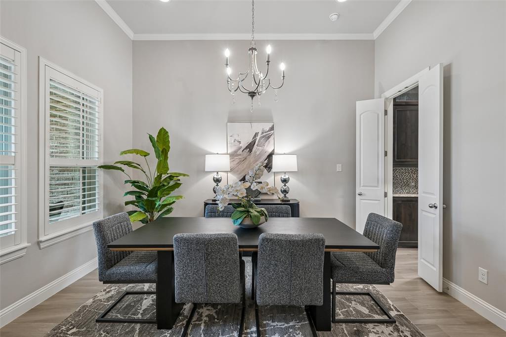 1657 Florence Road Keller, TX 76262 - Photo 5 of 40 a dining room with furniture potted plants and wooden floor