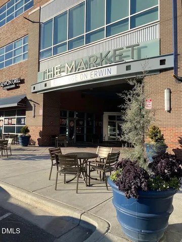 a view of a building with sitting area