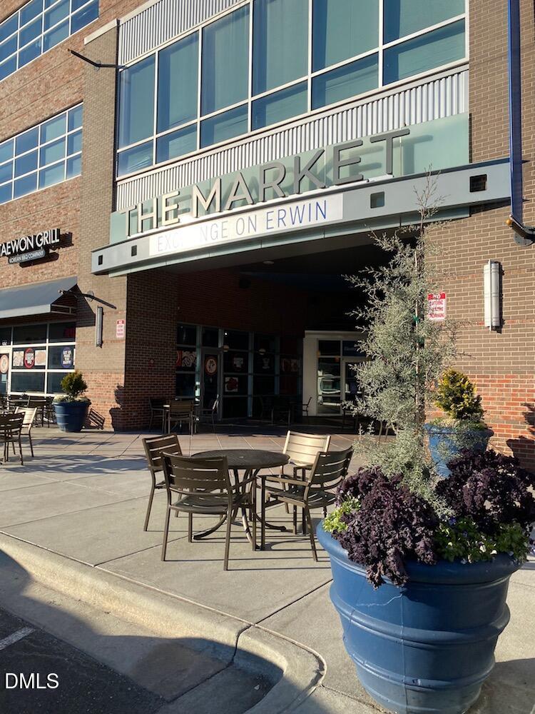 a view of a building with sitting area
