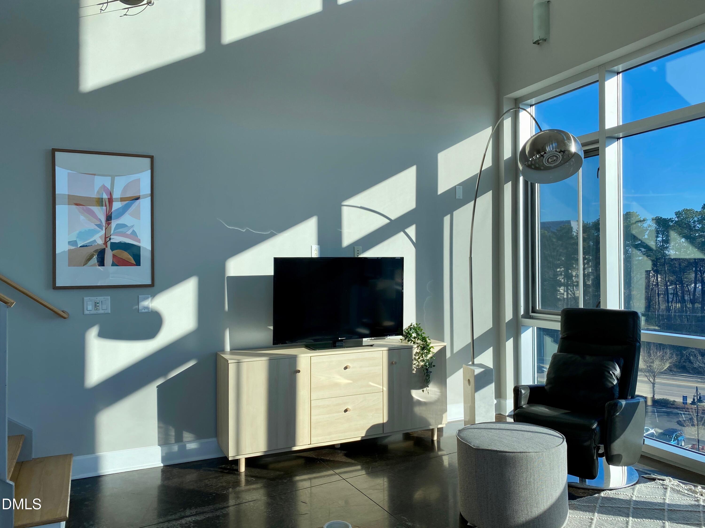 2608 Erwin Road, Unit 430 Durham, NC 27705 - Photo 19 of 43 a living room with furniture and a flat screen tv