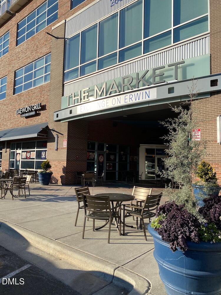 2608 Erwin Road, Unit 430 Durham, NC 27705 - Photo 2 of 43 a roof deck with a table and chairs and potted plants