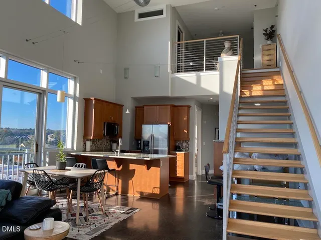 a lobby with furniture and floor to ceiling window