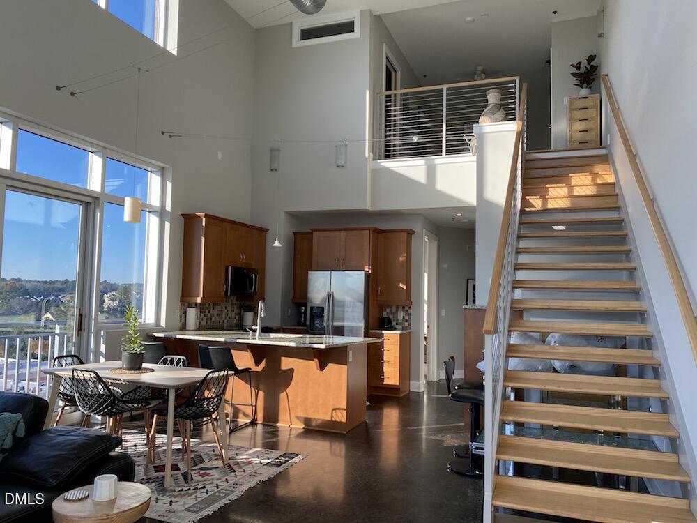 2608 Erwin Road, Unit 430 Durham, NC 27705 - Photo 26 of 43 a lobby with furniture and floor to ceiling window